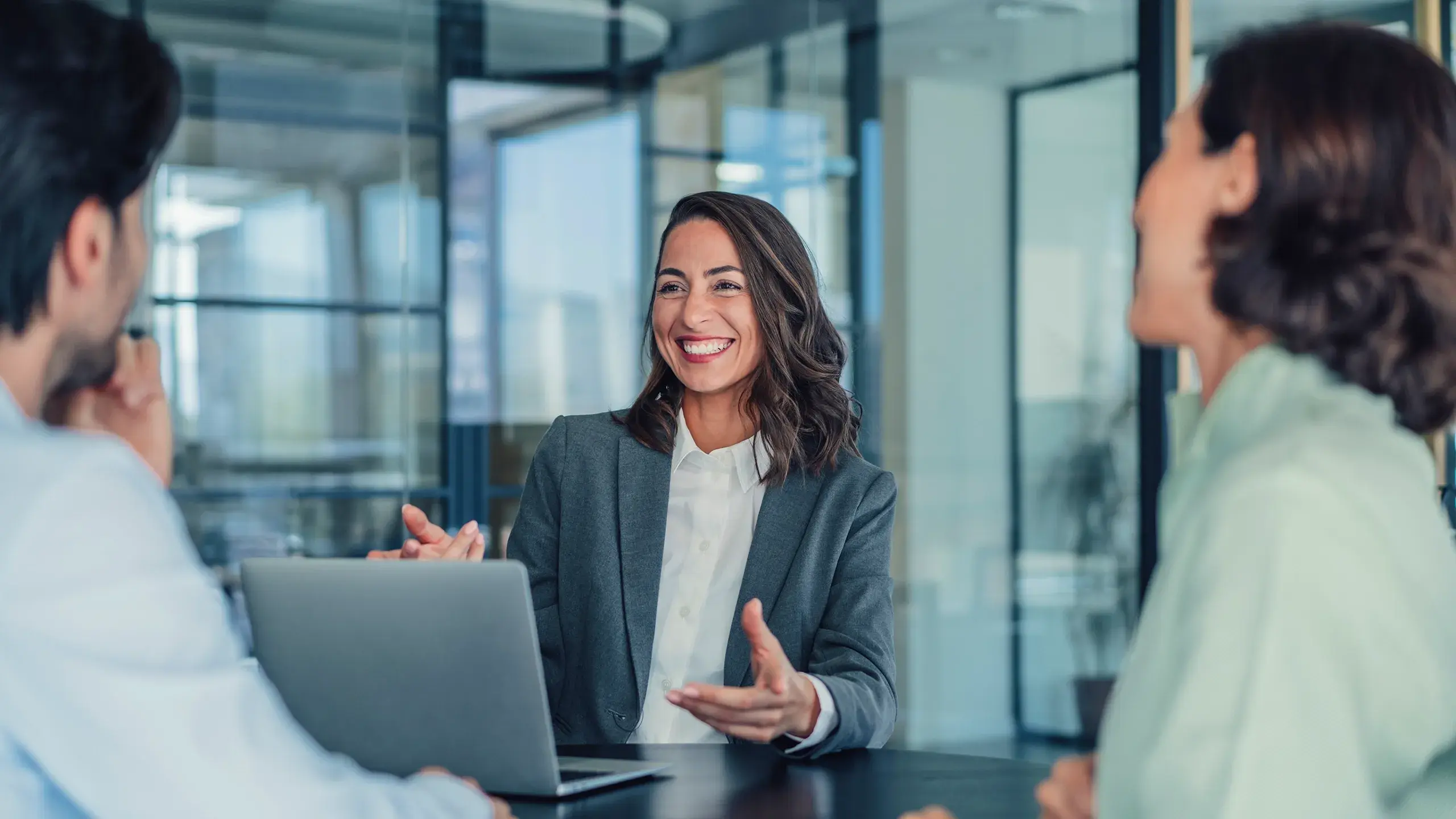 Consulting woman talking to couple discussing
